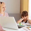 Tired and frustrated mother and child trying to do homework